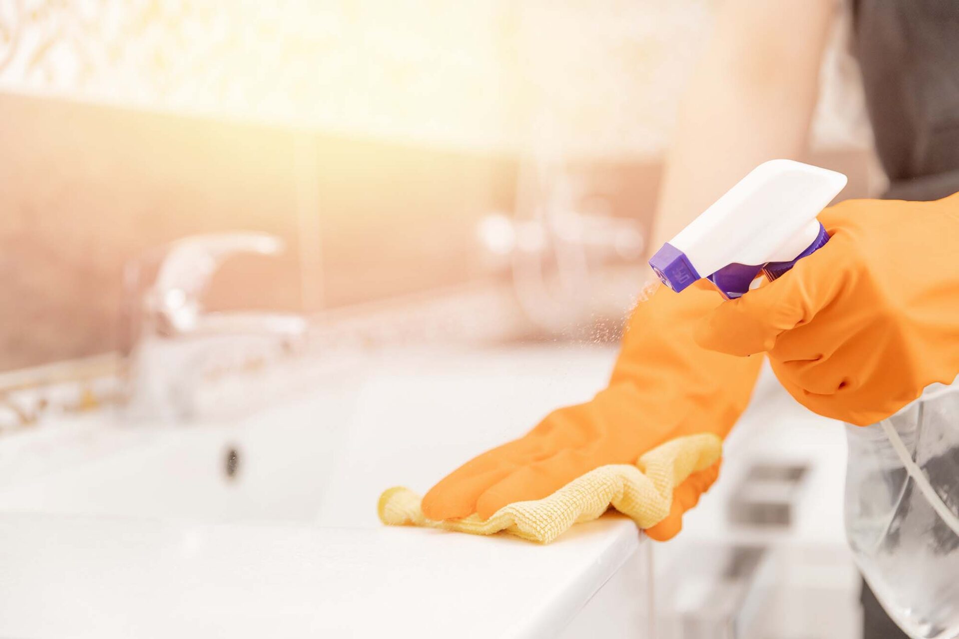 Wiping down a kitchen countertop